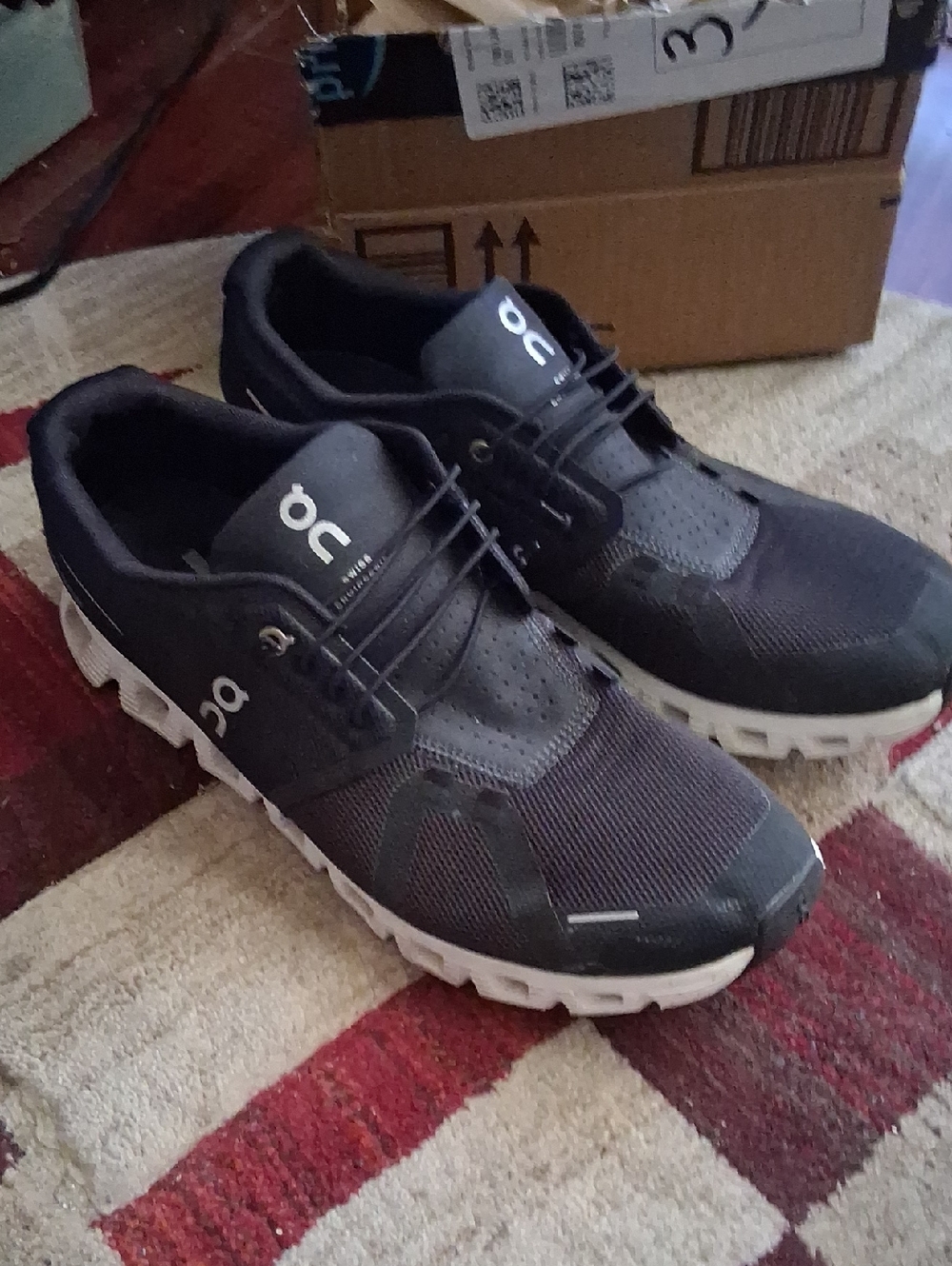 On Running Men’s Athletic Shoes in Black and White